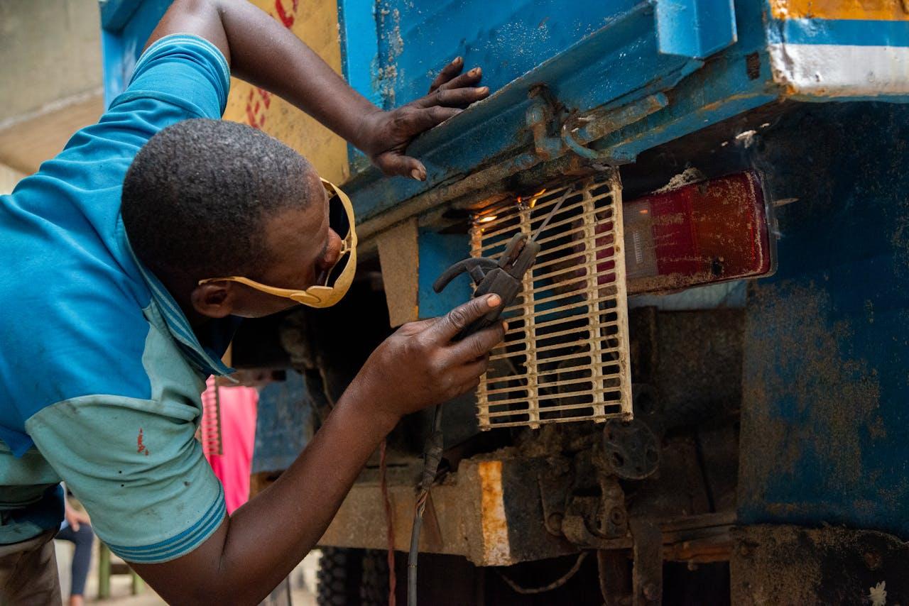 mechanic man repairing a truck